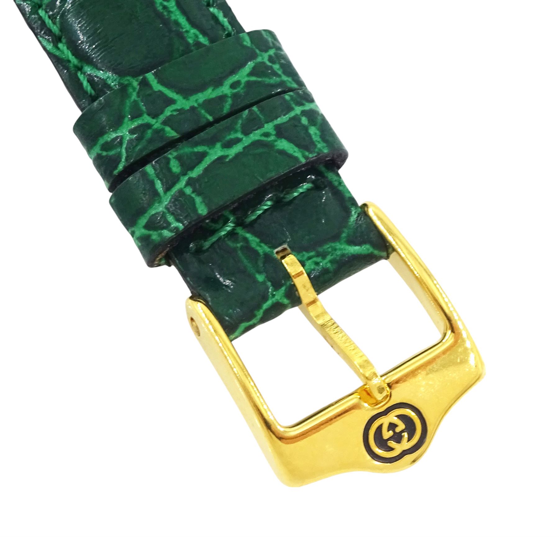 Gucci ladies gold-plated quartz wristwatch, Ref. 2600 L, silvered and green dial, on original green leather strap with gilt buckle, boxed
