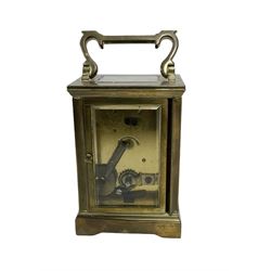 French - late 19th century 8-day timepiece carriage clock in an Anglaise case with carrying handle and rectangular bevelled glass panels, enamel dial with Roman numerals and steel spade hands, with a lever platform escapement, jewelled balance and timing screws. With key. 