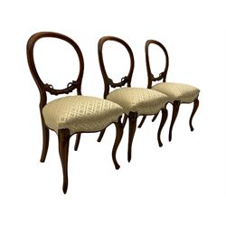 Set of six Victorian rosewood salon chairs, open balloon backs carved with foliage, fine scroll carved cabriole supports, overstuffed seats upholstered in damask fabric 