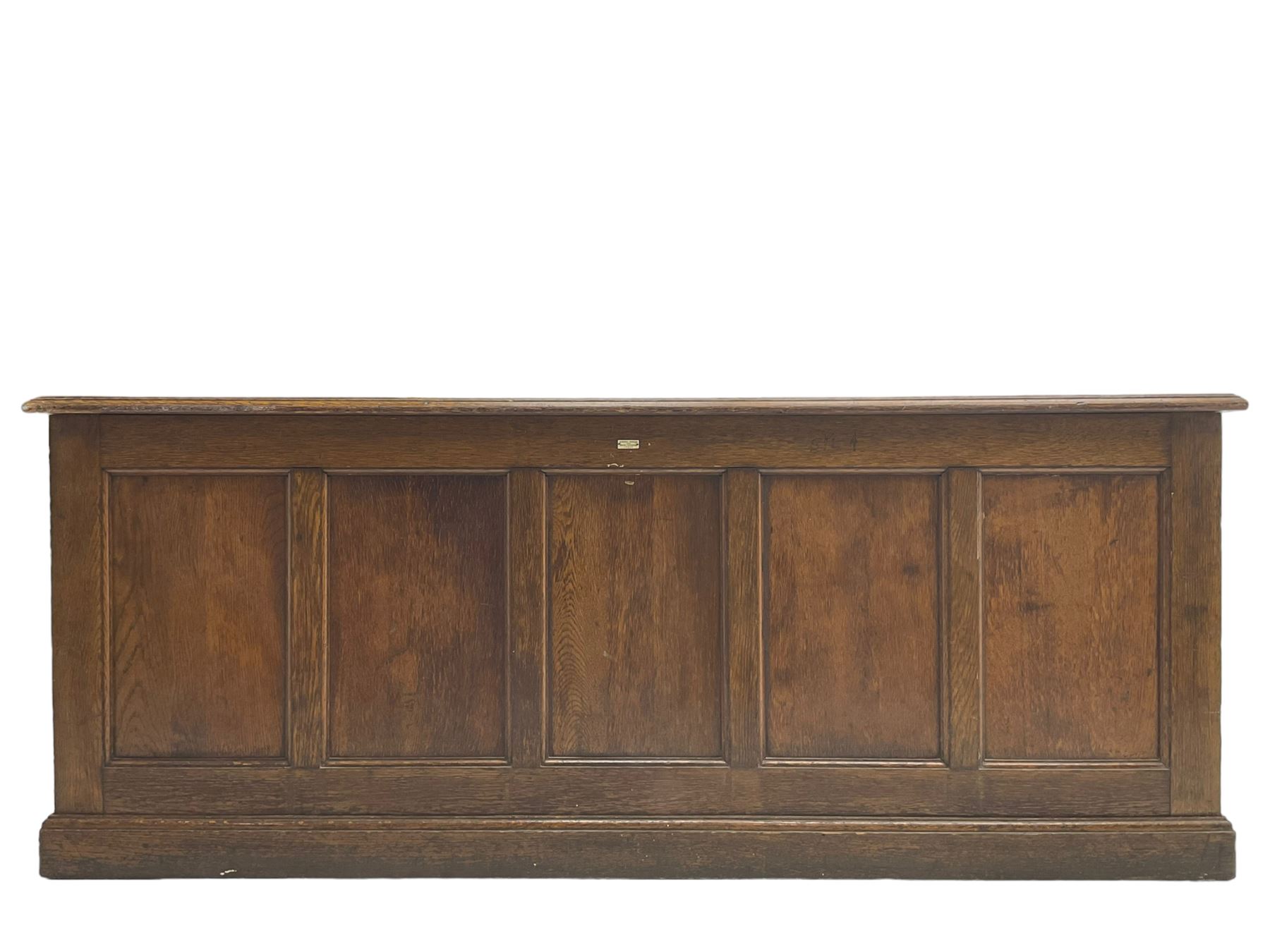 Illingworth Ingham and Co. School Furnishers (Leeds c1900) - early 20th century oak rostrum or headmaster's desk, rectangular top, the front and sides panelled with open reverse, on plinth base