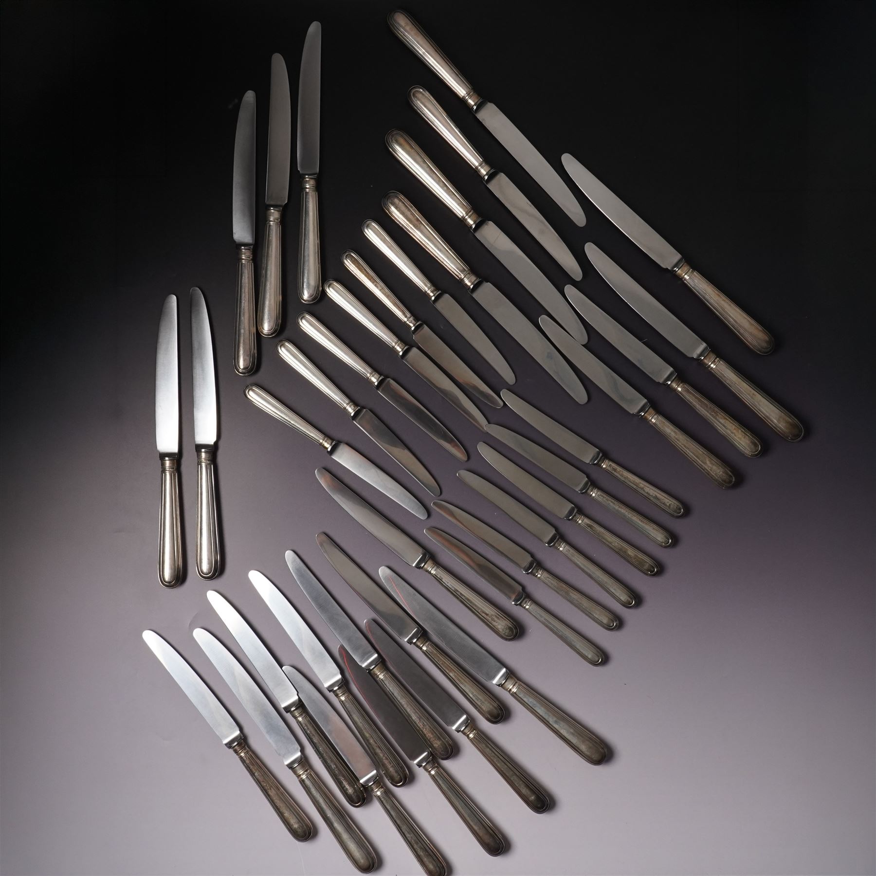 Set of twelve Elizabeth II silver handled double thread pattern table knives and twelve matching dessert knives Sheffield 1967 Maker C J Vander Ltd and a set of twelve matching silver handled pastry knives Sheffield 1970 Maker C J Vander Ltd (36) 