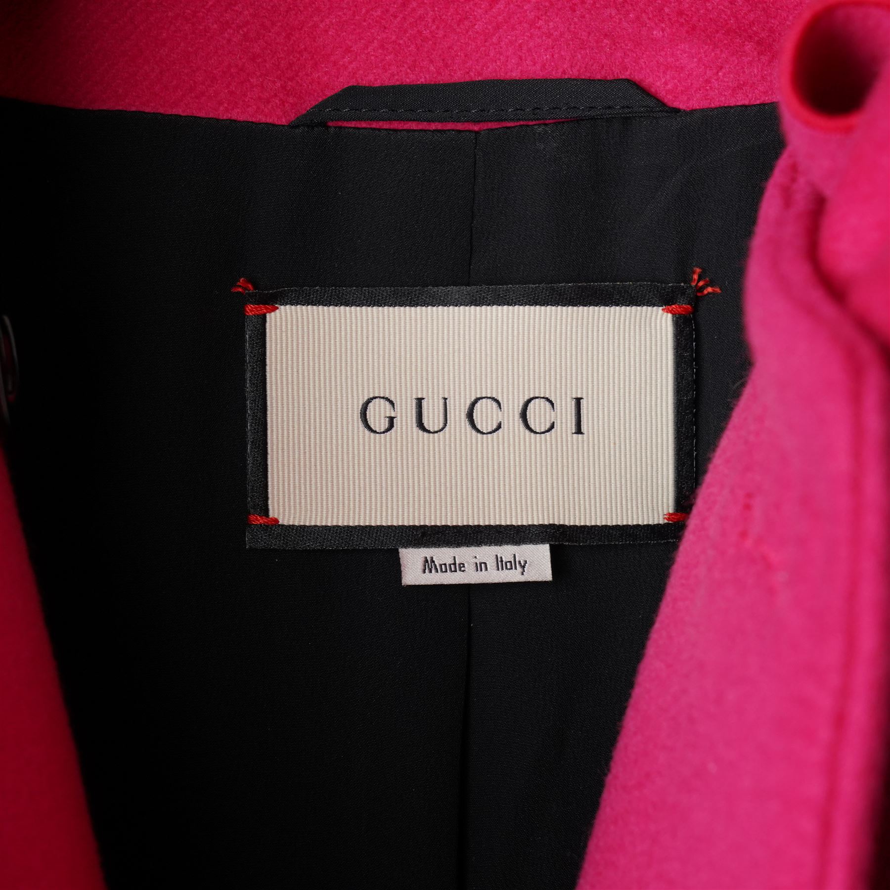 Gucci - wool ruffle-front single-breasted coat in bright fuchsia pink, with high ruffled collar, cascading ruffle trim to the front, collar and cuffs, faux pearl and gilt GG monogram logo button fastening, size 44, unused with the original garment bag and hanger