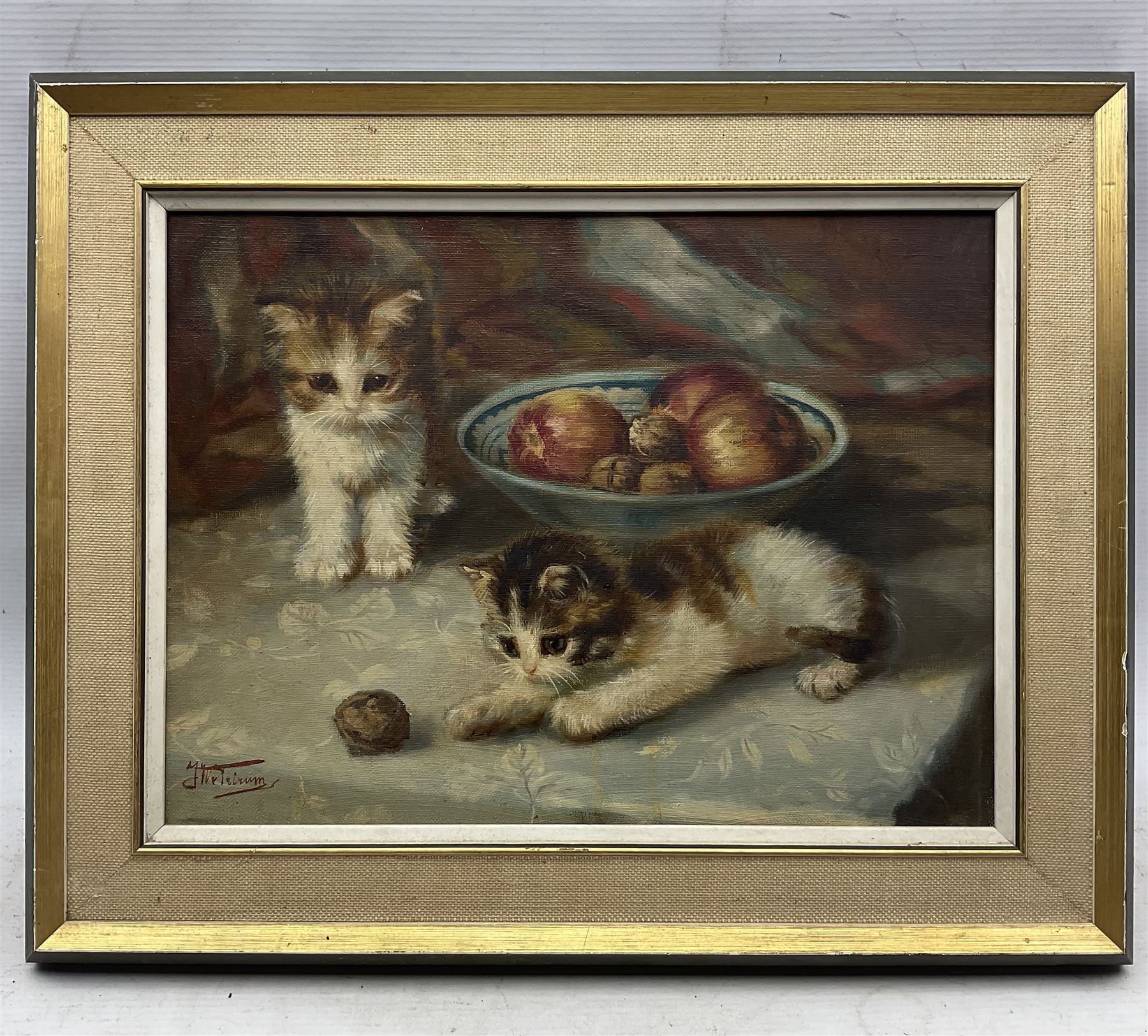 Johannes Wouterus Van Trirum (Dutch 1924-2011): Kittens and a Pesky Walnut, oil on canvas signed 18cm x 38cm 