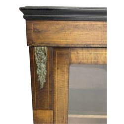Victorian walnut pier cabinet, moulded rectangular top over inlaid frieze, enclosed by two glazed doors, the uprights with further inlay and ornate floral cast gilt metal mounts, chamfered plinth base on turned feet