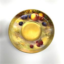 A Royal Worcester fruit painted cabinet coffee can and saucer, hand painted with apples, grapes and raspberries upon a mossy ground, the cup interior and centre of saucer gilded, cup signed H Austin [?], saucer signed H Price, each with puce coloured printed marks beneath, cup H5cm, saucer D11.5cm. 