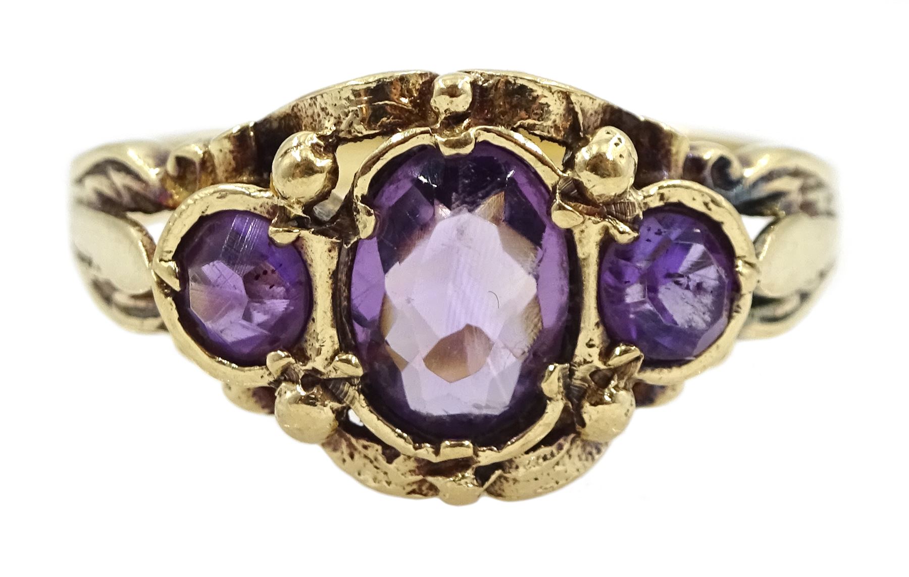 Gold amethyst pendant, stamped 18K, on 9ct gold chain necklace and a 9ct gold three stone amethyst ring, hallmarked