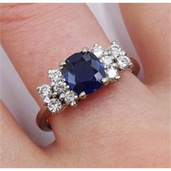 White gold cushion cut synthetic sapphire, each side with five round diamonds, stamped 18ct