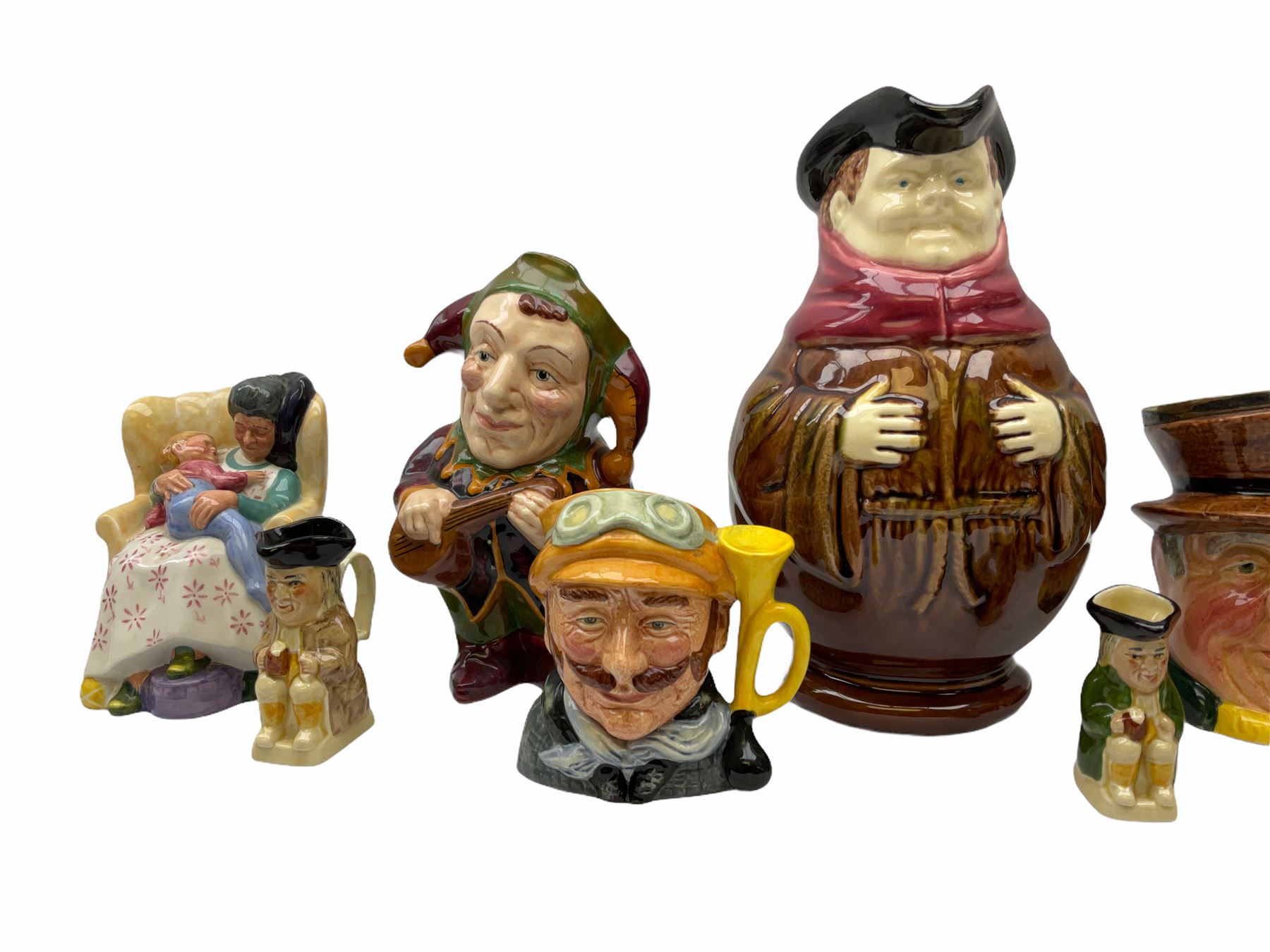 Character and toby jugs, including a staffordshire pottery style toby jug, Olfaire toby jug, Beswick character jug depicting Scrooge, Royal Doulton Veteral Motorist etc, together with Royal Doulton Sweet Dreams figure. 