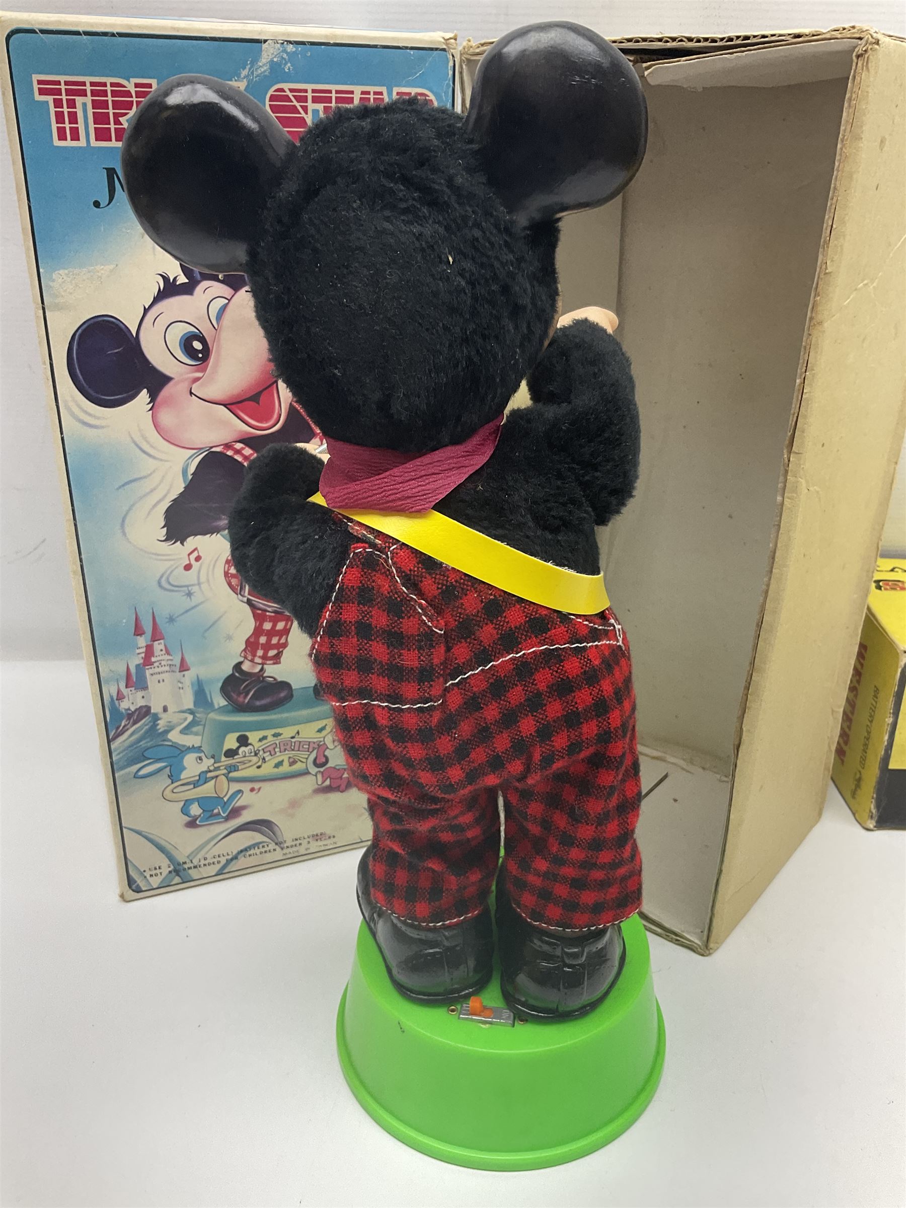 Mickey Mouse Trick Star battery operated drummer figure; Illco Mickey Mouse battery operated Fun Castle Roller Coaster; battery operated Western Express Locomotive; and JK Wells Fargo Overland Stage scale model; all boxed (4)