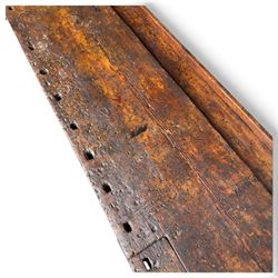 Large early 20th century rustic stained reclaimed pine workbench, the substantial plank top with recessed tool well and two homemade wooden screw vices, above a single frieze drawer and slatted undertier, raised on trestle end supports