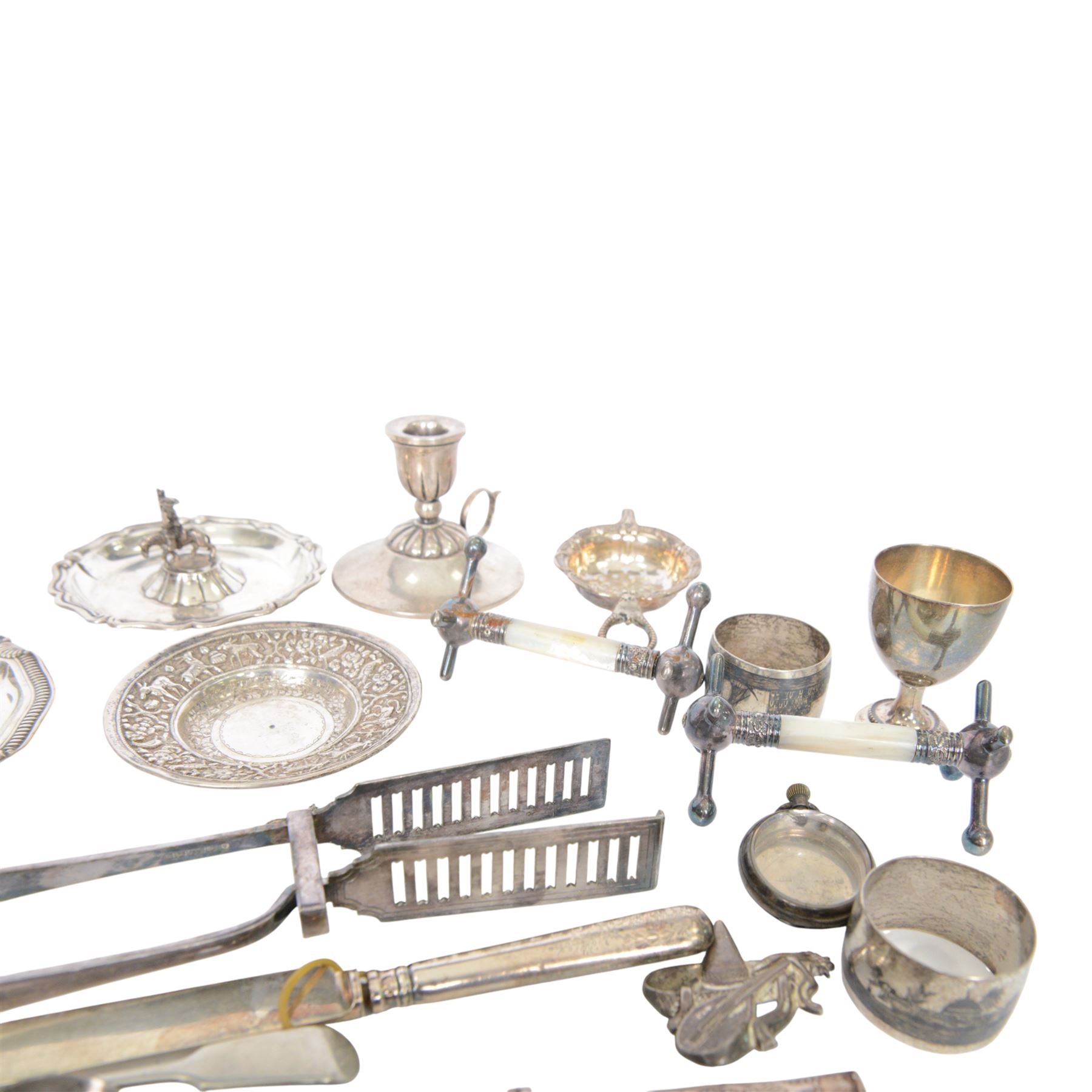 Group of silver, including sugar tongs, christening set, egg  cup, salt, strainer, silver mounted cutlery and Continental silver, together with silver plated items and other metalware 