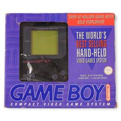 Nintendo Gameboy handheld game console in black, boxed, with seven games comprising Pokemon Blue, Arcade Classic 3: Galaga and Galaxian, Tetris, Tetris 2, Wario Blast, Arcade Classics Super Breakout Battlezone and Arcade Classics 1 Asteroids and Missile Command, all unboxed