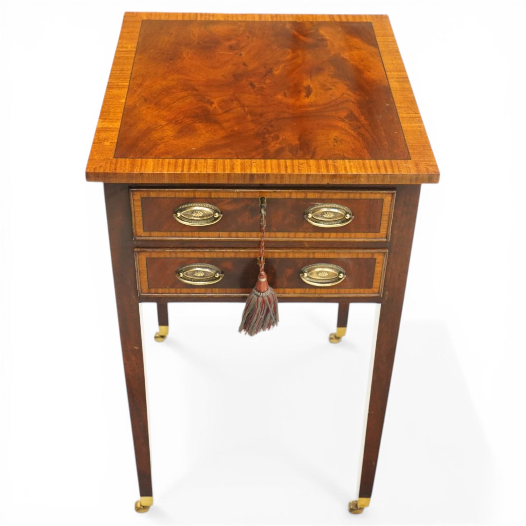 Georgian design inlaid mahogany collectors table, rectangular cross-banded top, fitted with two cock-beaded display drawers with interior glazed tops, with opposing faux drawers, fitted with pressed brass handle plates, on square tapering supports with castors, with keys