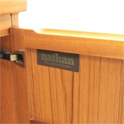 Nathan - teak wall unit, the arched open display recess above a glazed cabinet enclosed by two cupboard doors fitted with internal shelving, the lower section with a recessed serving surface over a pair of signature square panelled cupboard, raised on an integrated plinth base