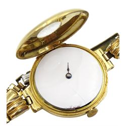 Early 20th century 18ct gold half hunter manual wind wristwatch, white enamel dial with Arabic numerals to outer case, the case by Stockwell & Co, London import marks 1919, on gilt strap