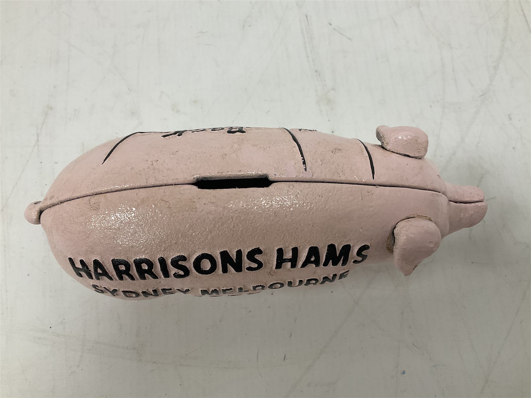 Cast iron Harrisons Hams money box, H10cm