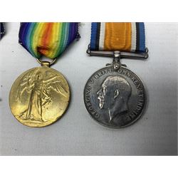 WW1 group of three medals comprising British War Medal, 1914-15 Star and Victory Medal awarded to 1781 Pte. W. Cartwright Manch. R.; and another WW1 British War Medal awarded to 30284 Pte. W.H. Paterson Manch. R.; all with ribbons (4)