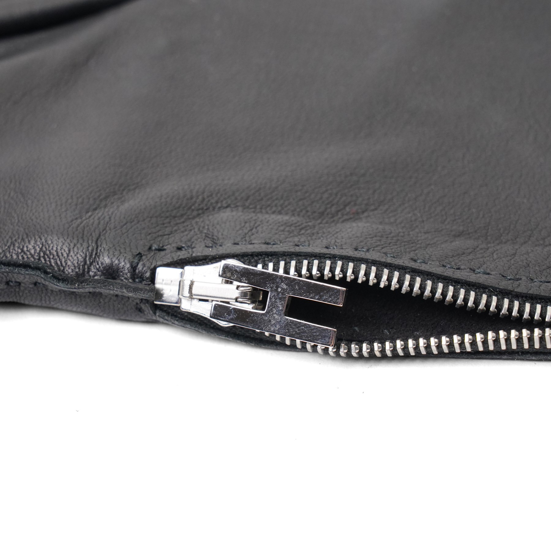 Hermès - pair of black leather long gloves, with H monogram zip fastening to the outer wrist and palladium-tone hardware, with original box