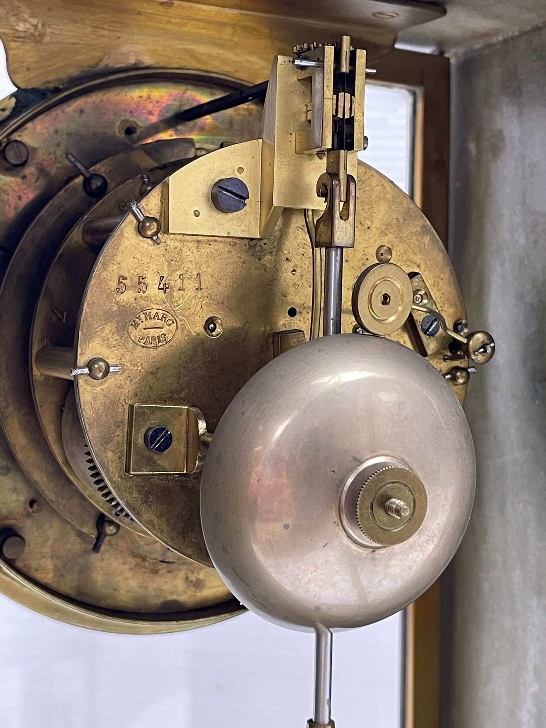 Henry Marc - Early 20th century 8-day French art deco mantle clock c1910, in a green mottled marble case with a stepped flat top and deep moulded plinth, brass framed bevelled front and rear glass doors, two part enamel dial with a visible Brocot deadbeat escapement and pendulum regulation, steel moon hands and Roman numerals, Parisian twin train rack striking movement with a visible twin file mercury pendulum, striking the hours and half-hours on a bell.