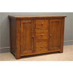  Oak sideboard, three drawers flanked by two cupboards enclosing shelves, square supports, W110cm, H81cm, D50cm  