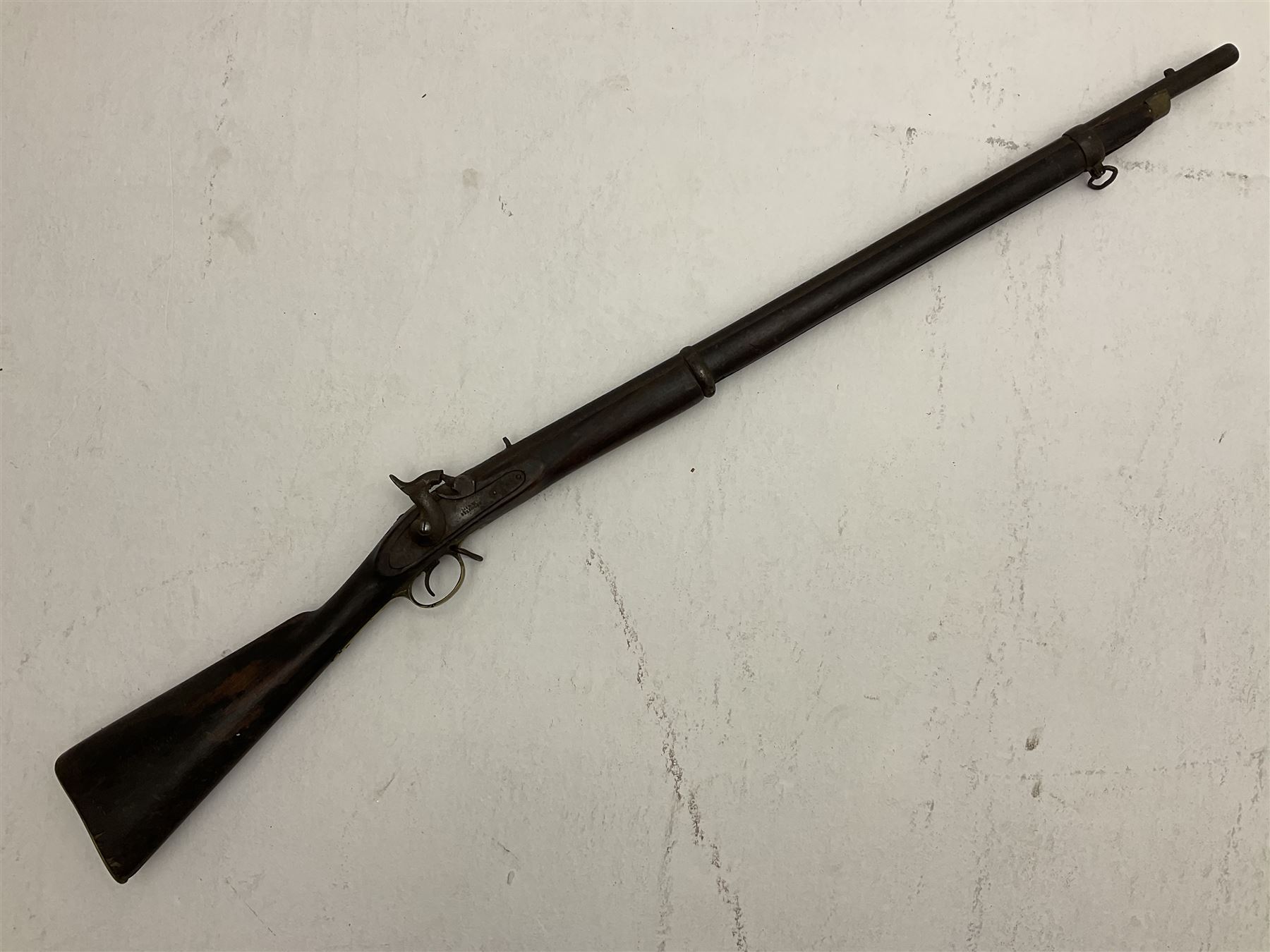 20th century Indian percussion musket, the 76cm barrel with two bands, indistinctly inscribed lock-plate, walnut full stock stamped 642 with brass butt and trigger guard and under barrel ramrod channel L121cm overall