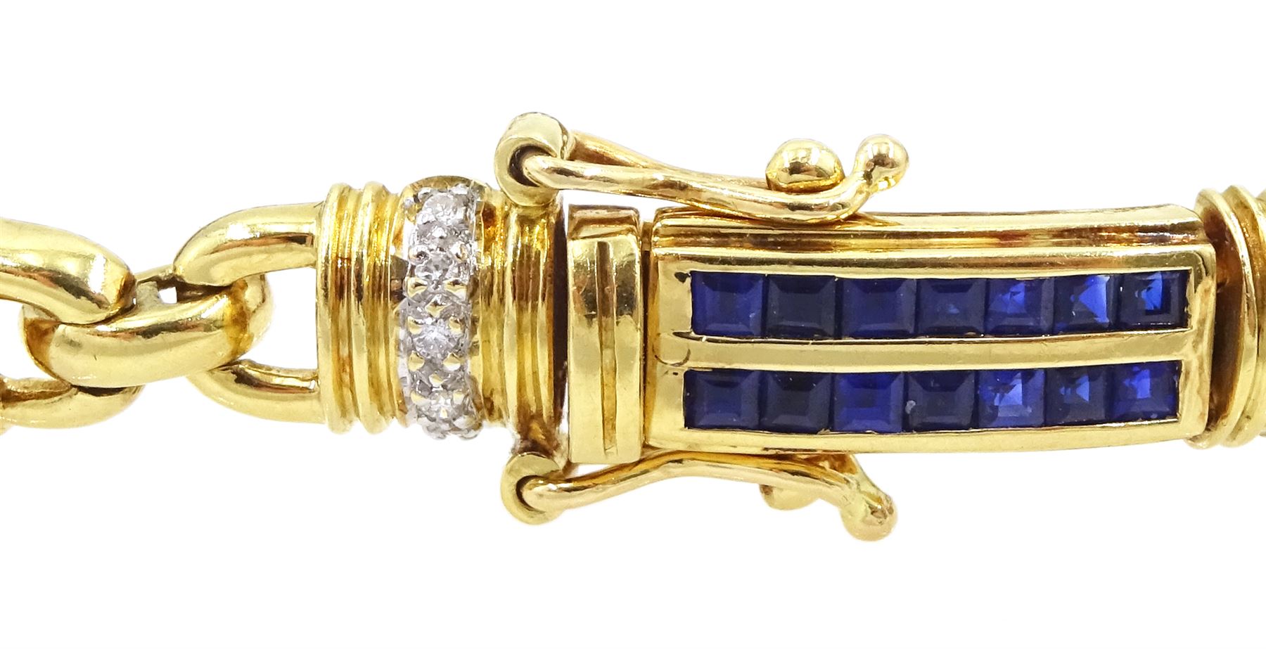 18ct gold sapphire and diamond bracelet, each link set with two rows of rectangular step cut sapphires, with pave set diamonds either side, stamped, total diamond weight 0.40 carat, total sapphire weight 2.50 carat, with World Gemological Institute report