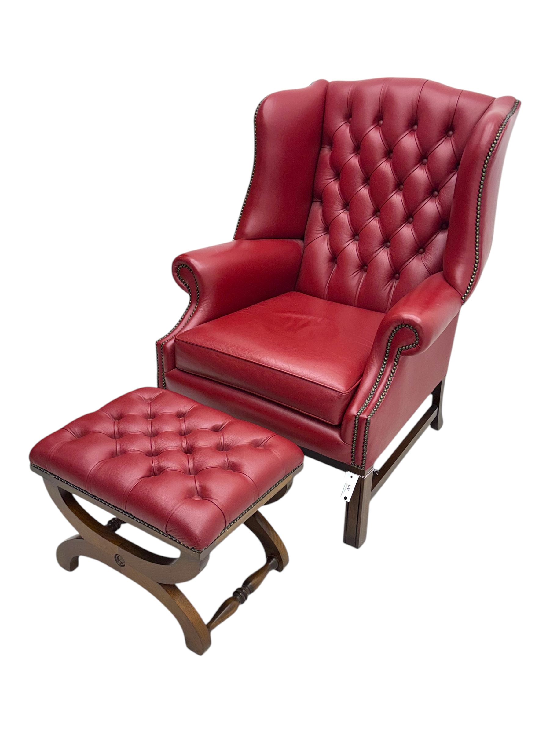 Kingsgate - contemporary 'Suffolk' wingback armchair and matching stool, upholstered in red leather with deep button tufting and brass stud trim, raised on square section supports 