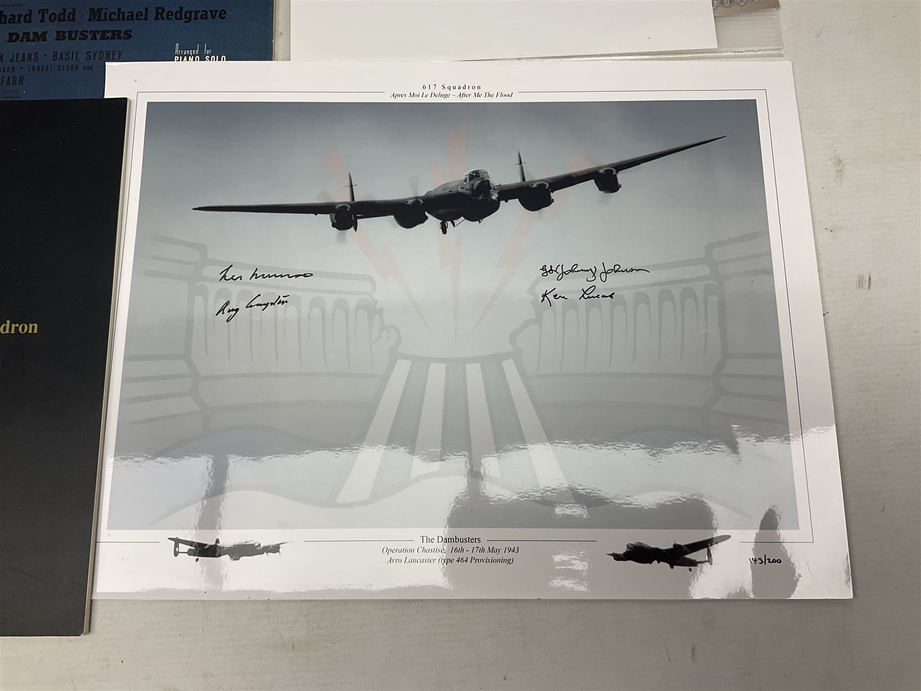 Dambusters 617 Squadron memorabilia - three signed photographs of Lancaster aircraft in flight, group photograph, copy of Vickers-Armstongs letter and drawing from Barnes Wallis, The History of 617 Squadron by Sqn. Ldr. S.J. Hillier, facsimile sets of signatures, FDCs, sheet music, Richard Todd signed photograph and greeting card, etc