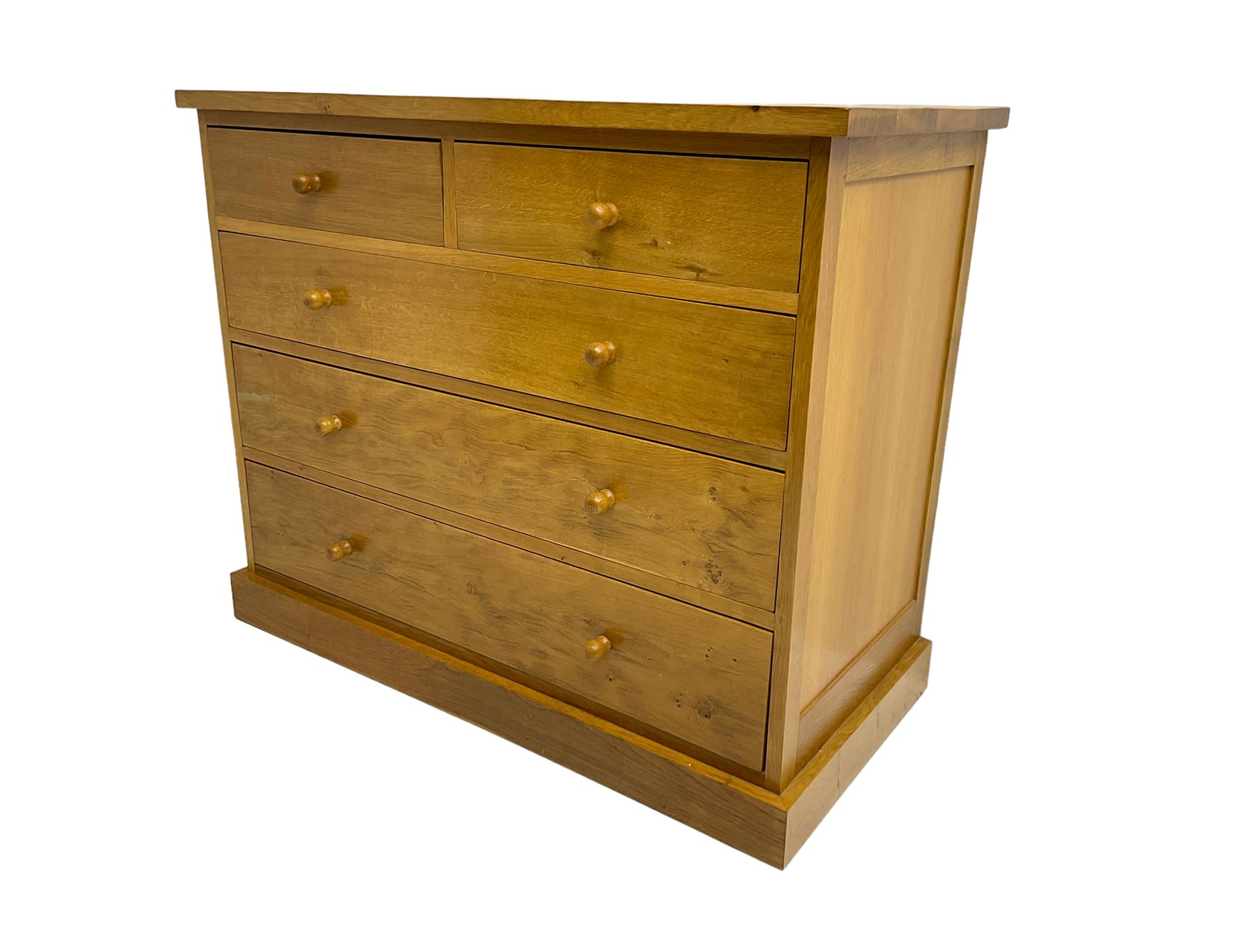 Craftsman made light oak chest, fitted with two short and three long drawers, on plinth base