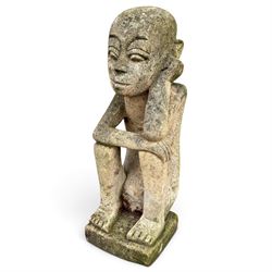 Balinese design weathered cast stone figure of an ancestral guardian, modelled in a squatting pose 