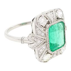 Platinum emerald and diamond cluster ring, single octagonal cut emerald of 2.52 carat, surrounded by milgrain set round brilliant cut and single cut diamonds, stamped PT950, total diamond weight 0.82 carat