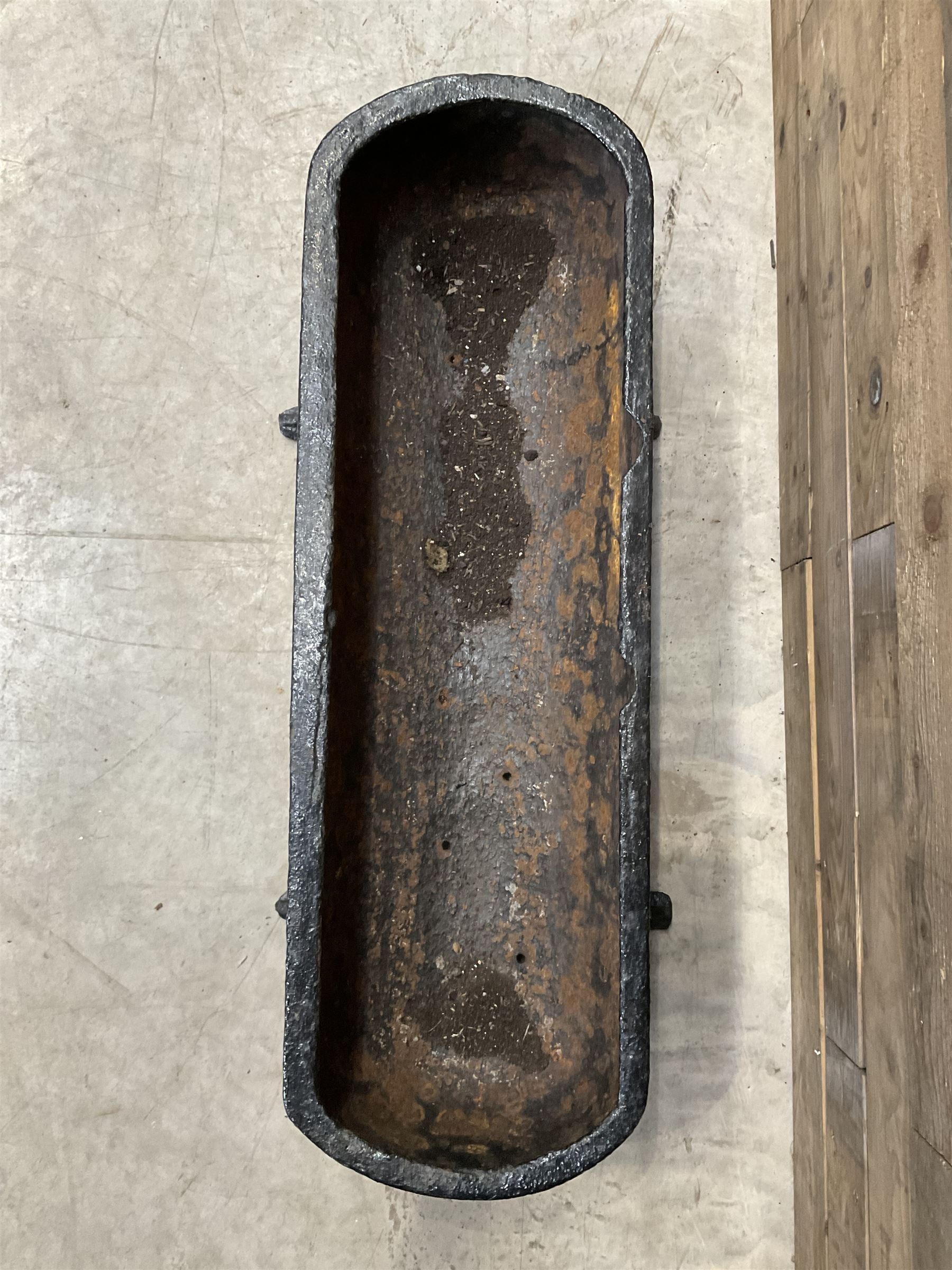 19th century oval black painted cast iron feeding trough planter