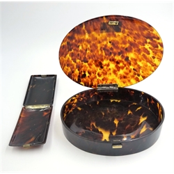  Early 20th century oval tortoiseshell jewellery box, silver hinges by Charles Henry Dumenil London 1916 and a silver mounted tortoiseshell cigar case both with sprung brass catches  