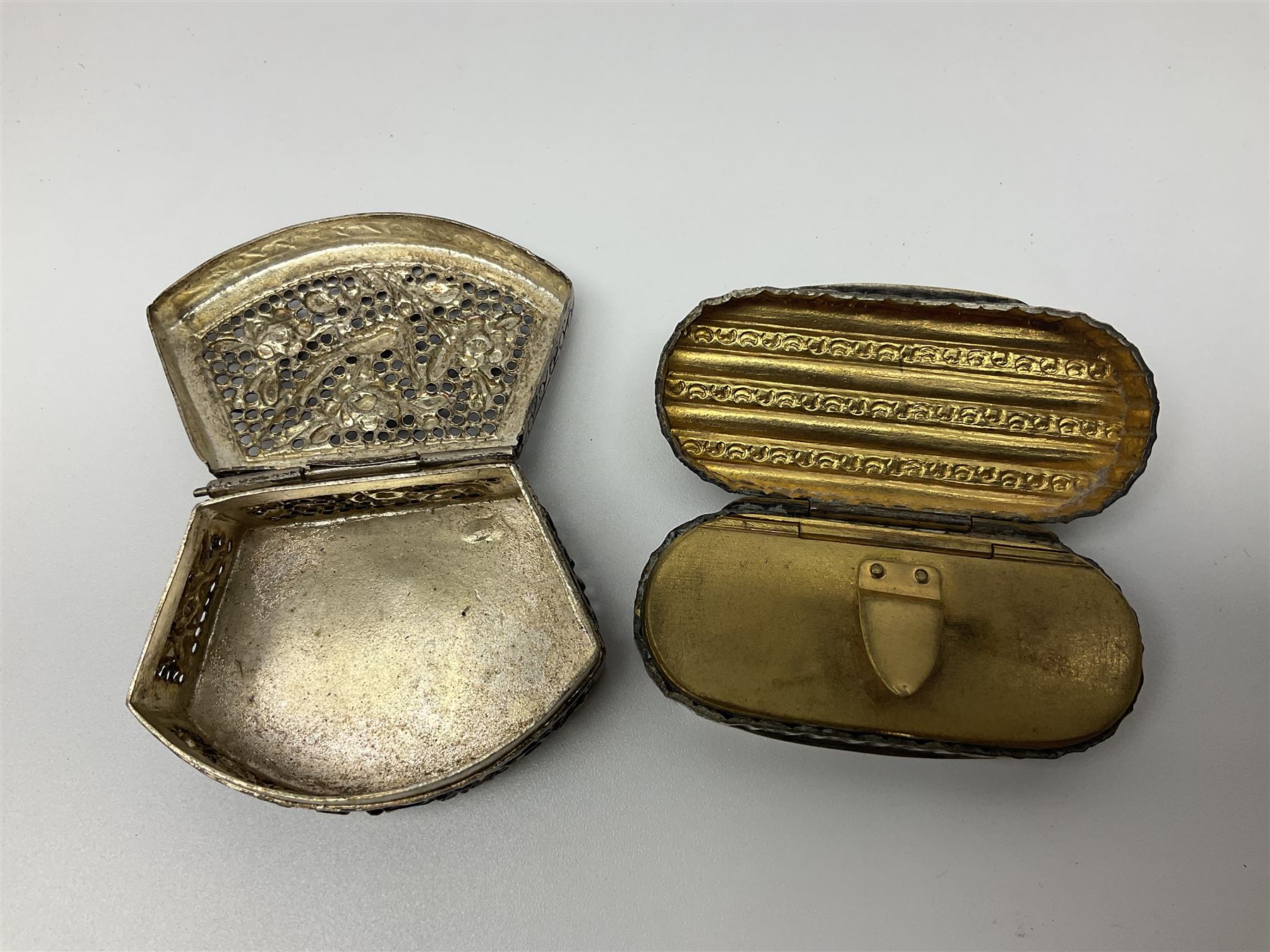Five snuff boxes, including novelty snuff box in the form of a shoe, pierced example, rectangular hinged lid with white metal decoration and two others  