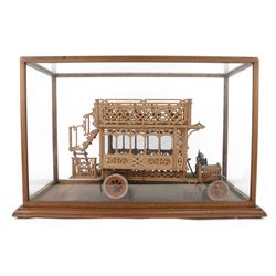 Early 20th century fretwork model of an omnibus, contained within glazed wooden case, case H45cm