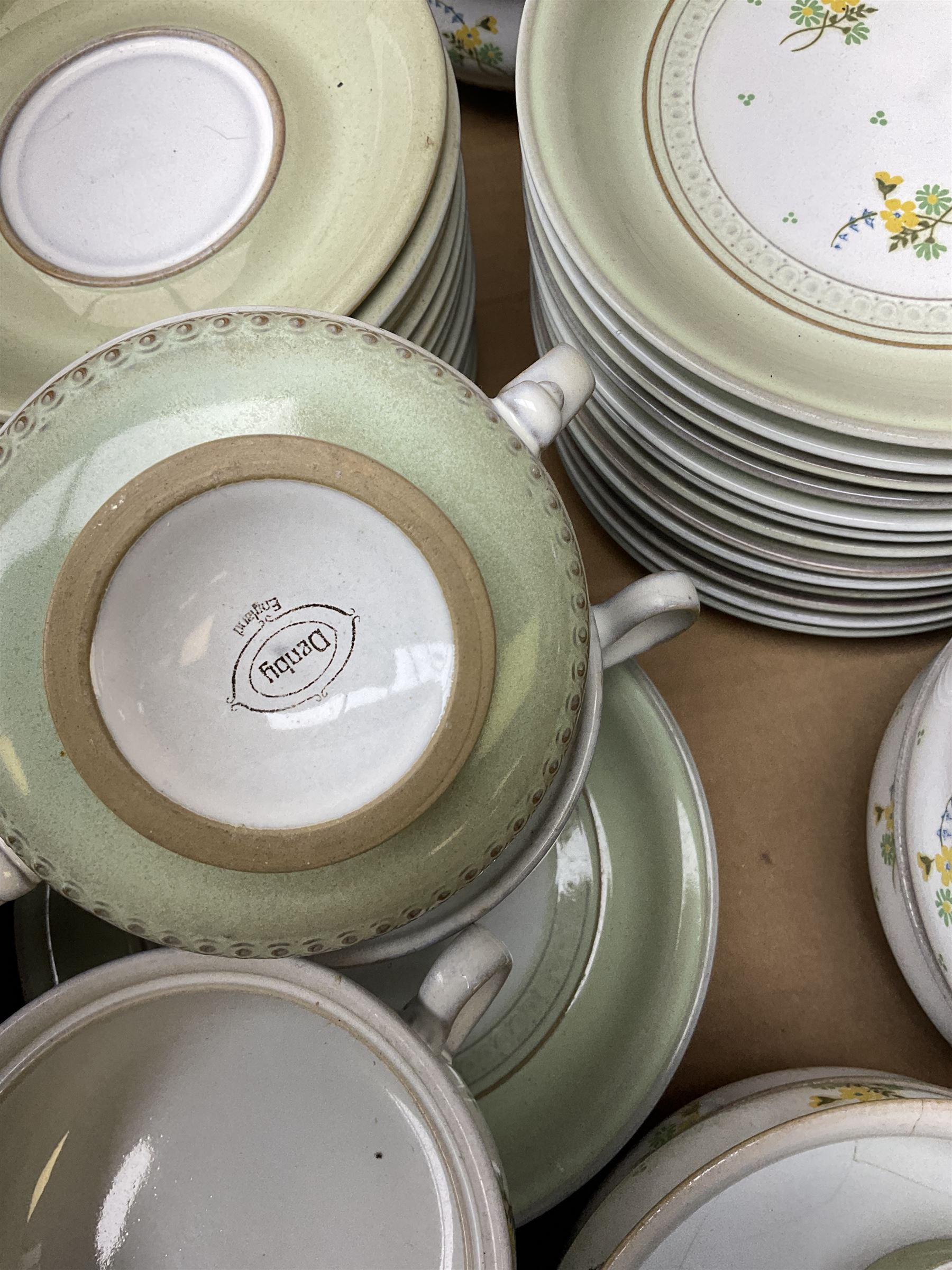 Quantity of Denby Verona pattern tea and dinner wares, decorated with floral sprays and within green borders, to include lidded twin handled bowls, teacups and saucers, dinner plates etc in two boxes