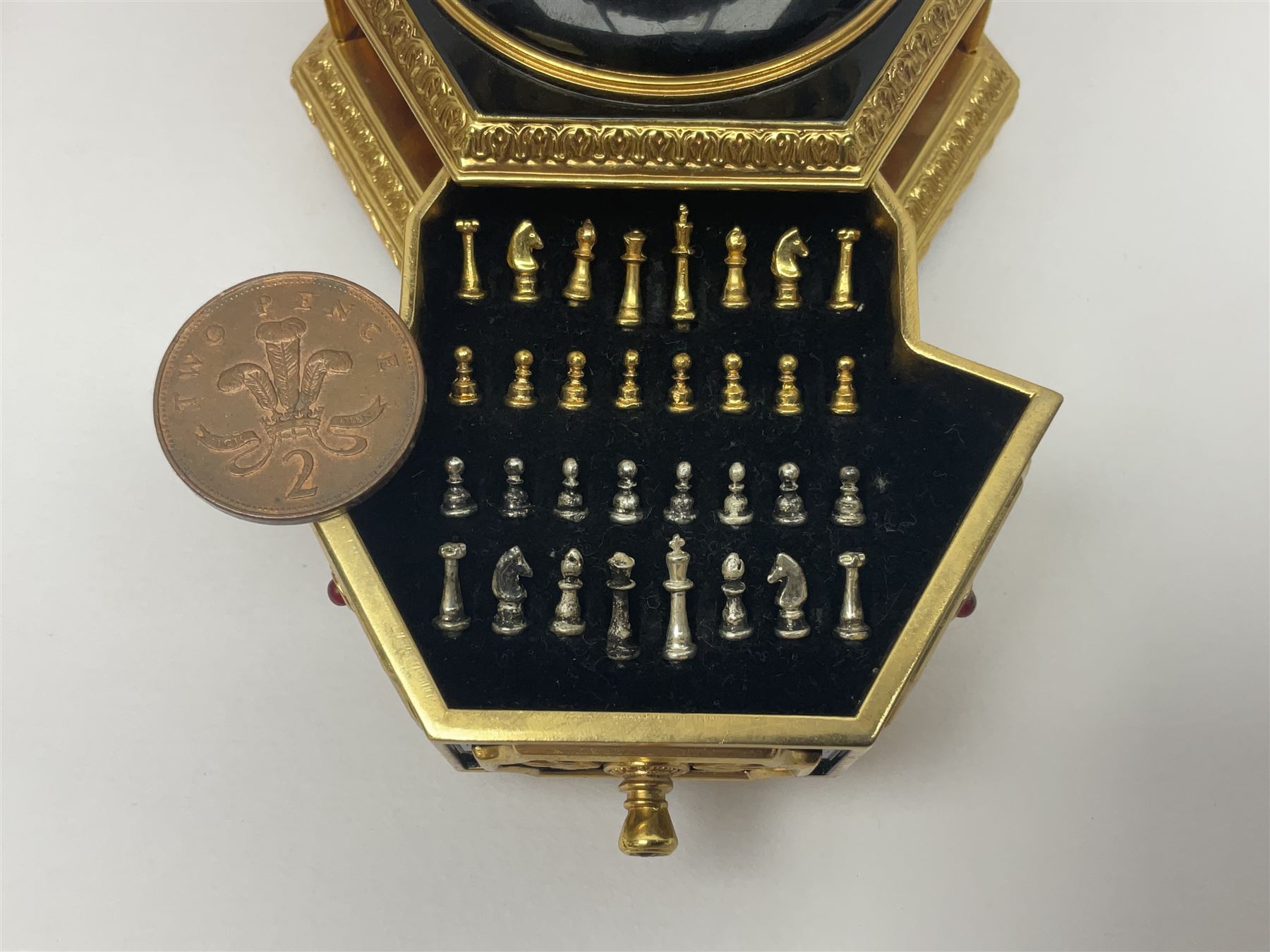 Franklin Mint House of Faberge; The Imperial Jeweled Egg Chess set, the egg opening to reveal a chess board, with a draw to the hexagonal base holding the miniature chess pieces, H23cm 