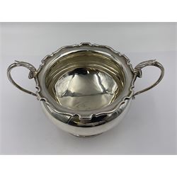 1920s five-piece silver tea service, comprising teapot, coffee pot, hot water pot, twin handled open sucrier and milk jug, each of squat circular form with shaped rim, the teapot, coffee pot and hot water pot each with ebonised handle and finial, the sucrier and milk jug with acanthus capped scroll handles, all upon circular foot, hallmarked R F Mosley & Co, Sheffield 1926 & 1927, tallest H24cm