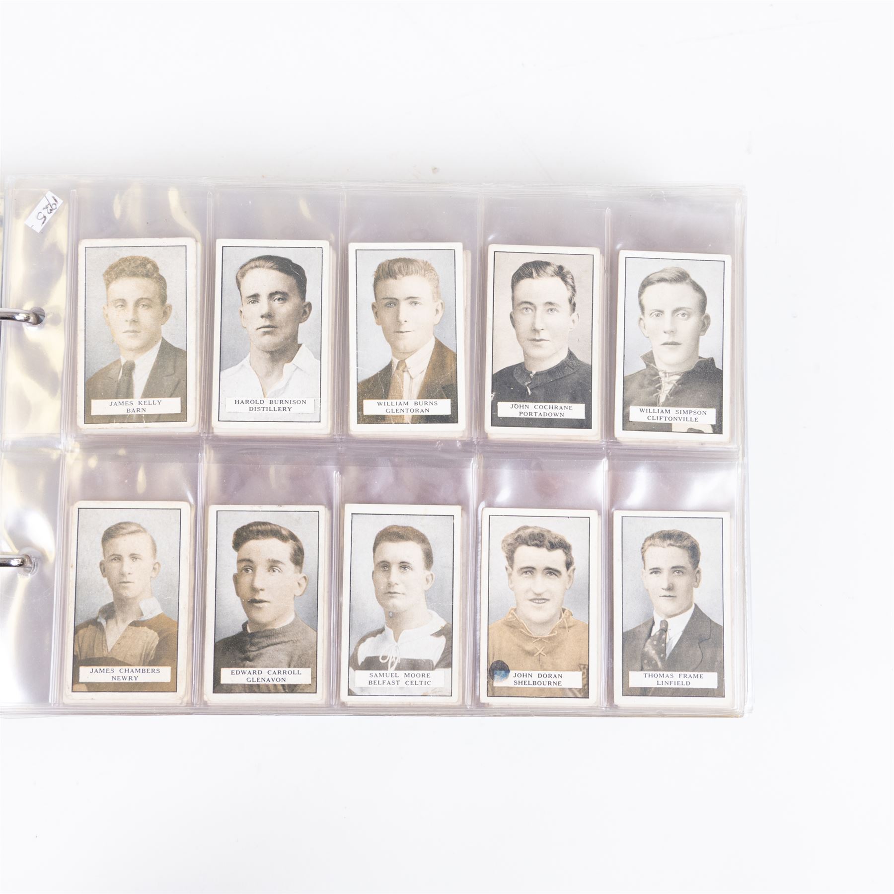 Collection of Edwardian and later Football related trading and cigarette cards, including forty-nine of fifty 1906 Ogden's Football Club Colours, 1922 PALS Footall series, ninety of one hundred 1925 Gallaher Famous Footballers, complete set of forty-four 1926 Ogden's Captains of Association Football Clubs and Colours, complete set of fifty 1927 Players Football Caricatures by MAC,  complete set of fifty 1927 Players Football Caricatures by RIP,  complete set of fifty 1930 Players Association Cup Winners, complete set of 50 1933 Ogdens AFC Nicknames etc, housed in brown cigarette card album