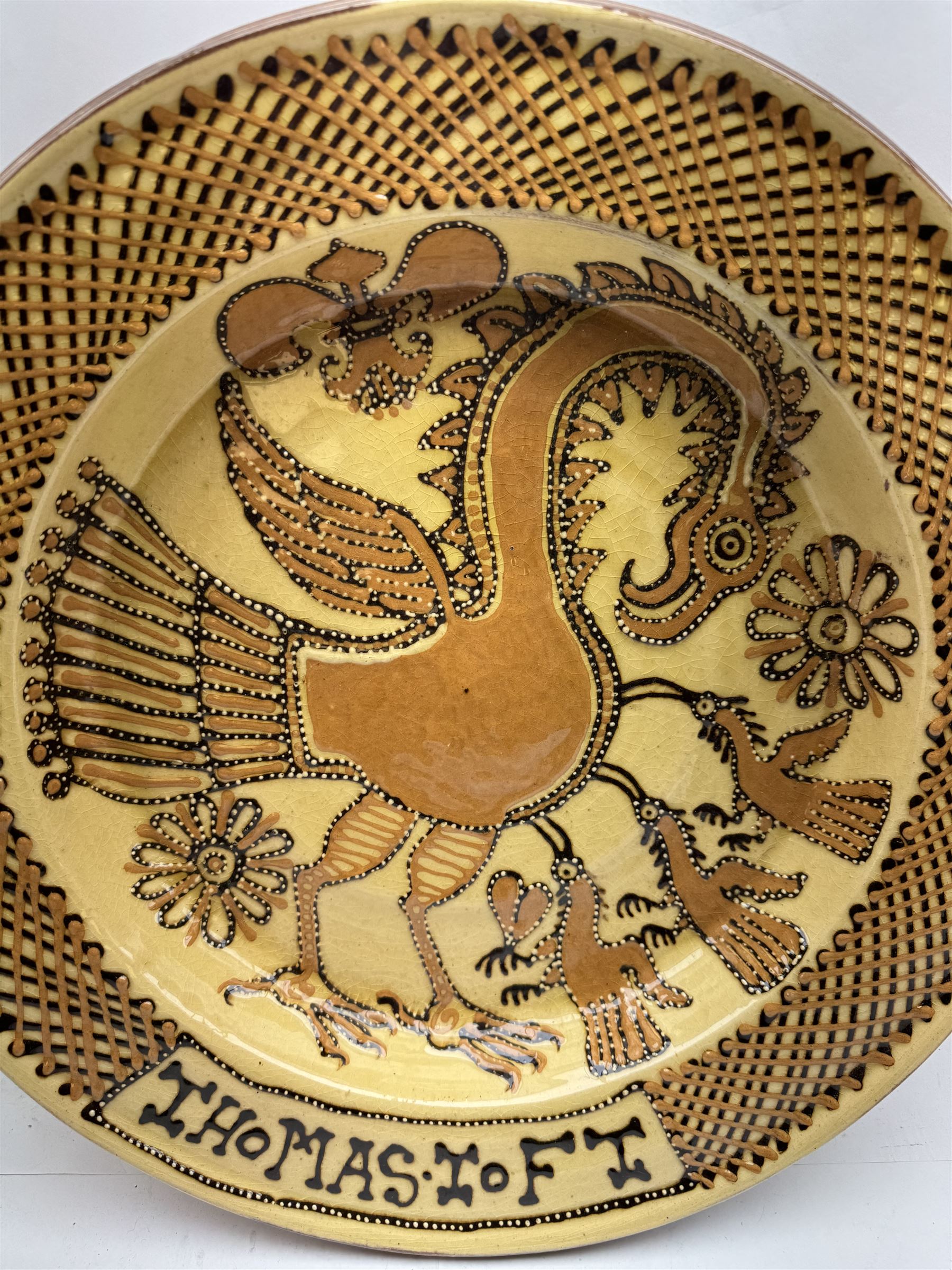 John Hudson: Large slipware charger in the style of Thomas Toft by John Hudson of Mirfield Pottery, decorated with a cockerel, incised marks verso, D 41cm.