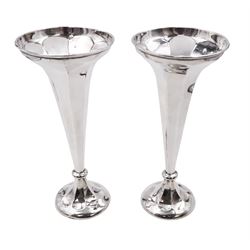 Pair of early 20th century silver trumpet vases, of tapering faceted form, upon spreading filled bases, hallmarked Thomas Edward Atkins, Birmingham 1911, H23cm