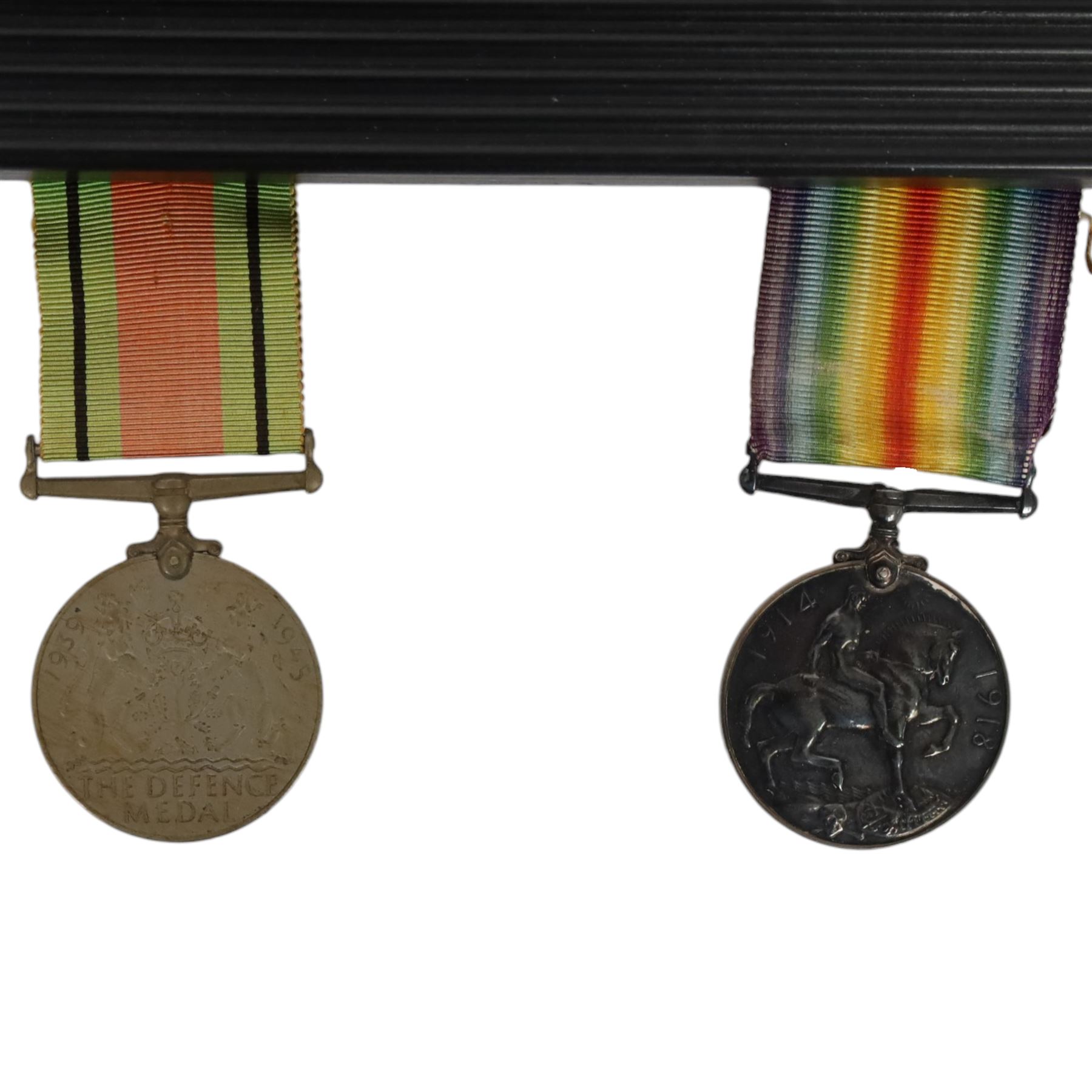 WWI medal trio; Victory medal, 1914/15 star and War medal, framed, together with WWI medal pair; victory and defence medals, awarded to 5832 Pte J Wilson North'O Fus, and WWII Defence Medal, framed