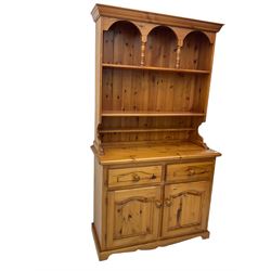 Solid pine kitchen dresser, fitted with plate rack above two drawers and two cupboards