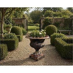 Circle of Coalbrookdale - 19th century cast iron and black painted campana shape urn with flared and scalloped rim, gadrooned underbelly on stepped square base