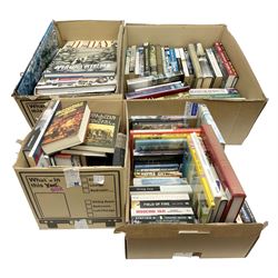 Large collection of hardback and paperback books, mainly military books, to include D-Day Operation Overload, Field of Fire, News from No Mans Lands, Churchill and the Wars at Sea, The Greatest Raid of all, etc in four boxes  