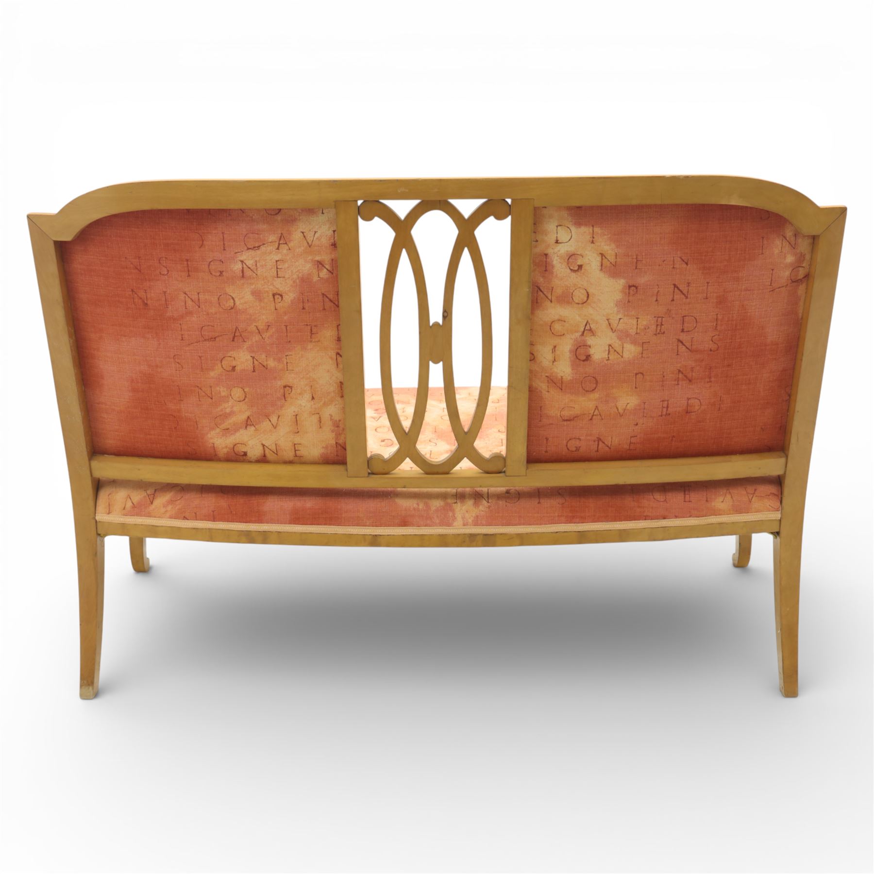 Edwardian satinwood settee, the shaped and bowed top rail enclosing a pierced splat with interlaced oval slats, flanked by upholstered back panels, the padded arms with scrolling terminals, the upholstered seat raised on cabriole supports with pad feet