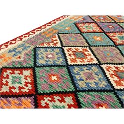 Anatolian Turkish Kilim multi-colour rug, decorated with all over lozenges in contrasting colours with dark indigo outline, the multi-band ivory and red border with repeating geometric shapes and small lozenges or diamonds