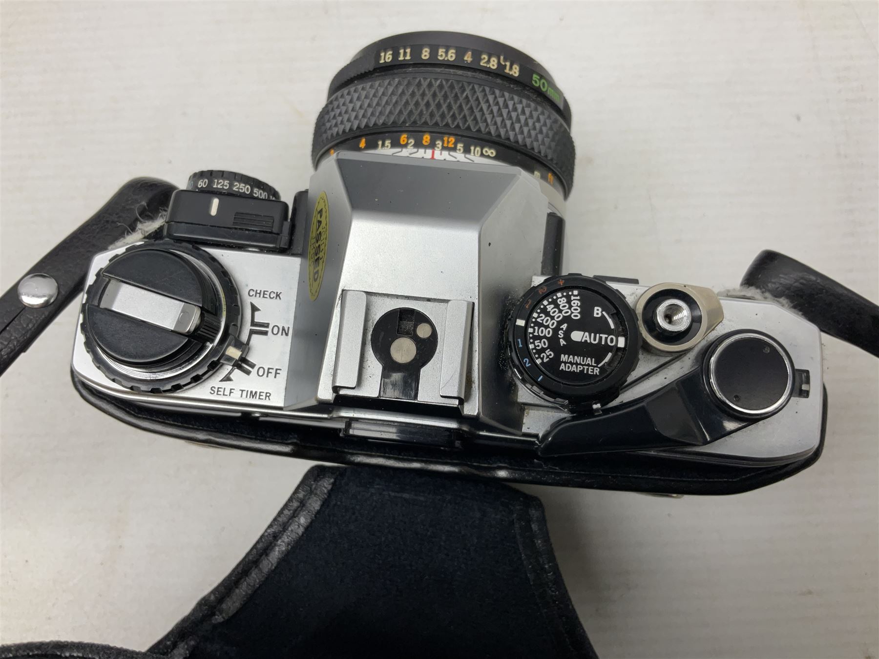 Olympus OM10 35mm camera, cased; pair of USSR 7 x 50 binoculars; cased; and pair of Le Jockey Club Paris binoculars