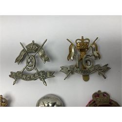Nine Lancers metal cap badges including 9th, 12th Royals, 24th, 16th Queens and 17th; together with eight various Guards/Dragoons badges (17)