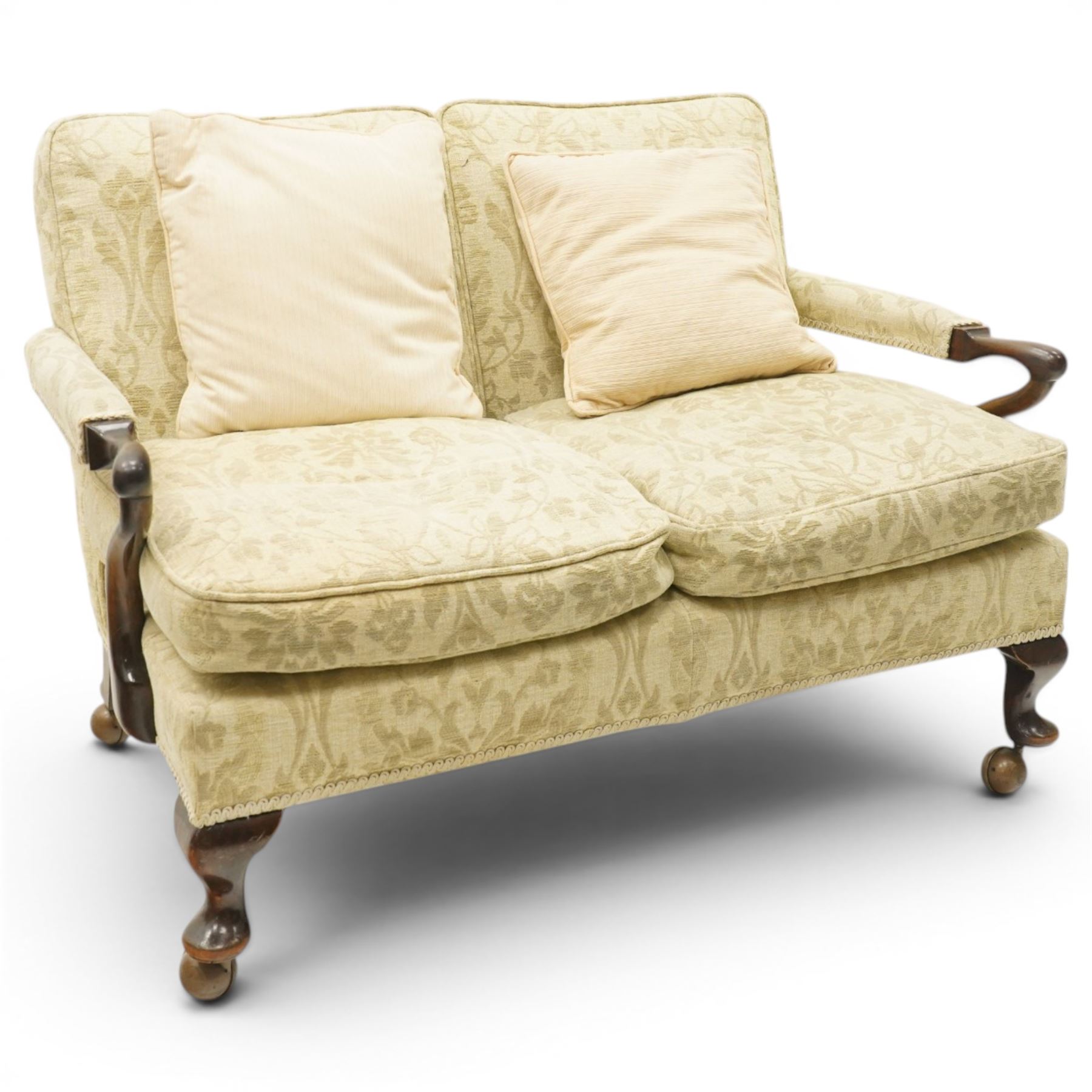 George II design mahogany framed three-piece salon suite, comprising settee and two armchairs, with pale green floral patterned upholstery, scroll carved arm terminals, loose cushioned seats and backs, raised on cabriole supports terminating in castors
Armchairs (H 80cm, W 62cm, D 73cm)